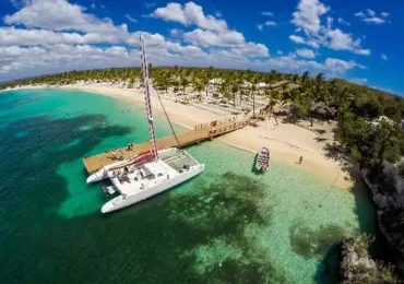 a boat close to a brigde in a beach