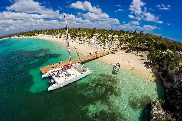 a boat close to a brigde in a beach